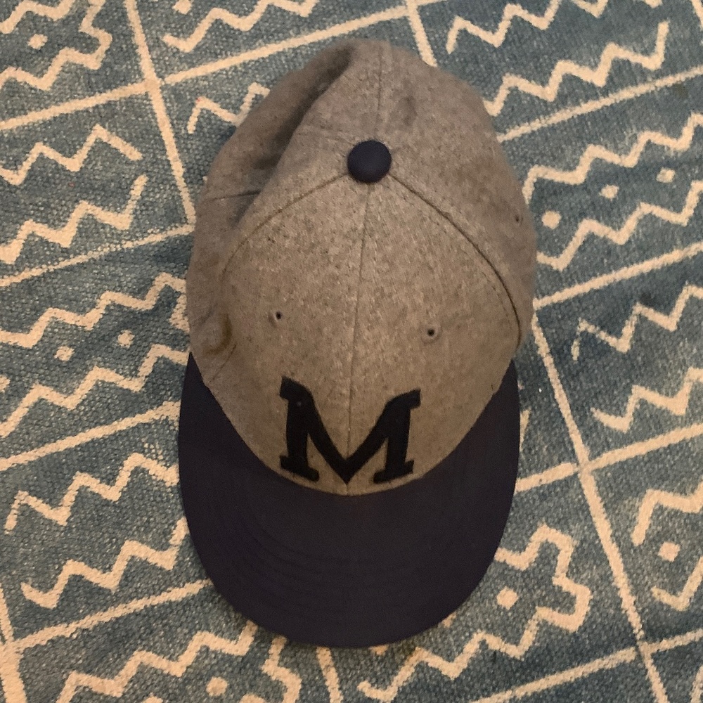 Initial "M" cap